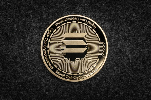 Solana SOL cryptocurrency physical coin on a dark background.